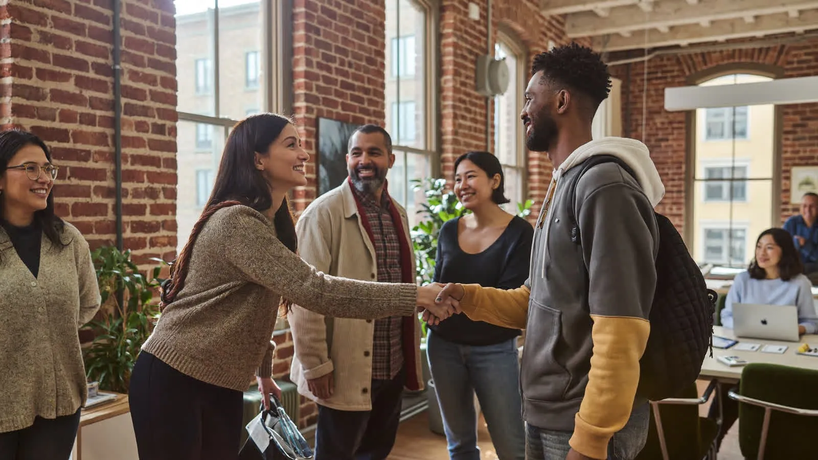 Founders, operators and talent from every background welcoming each other in a brick loft