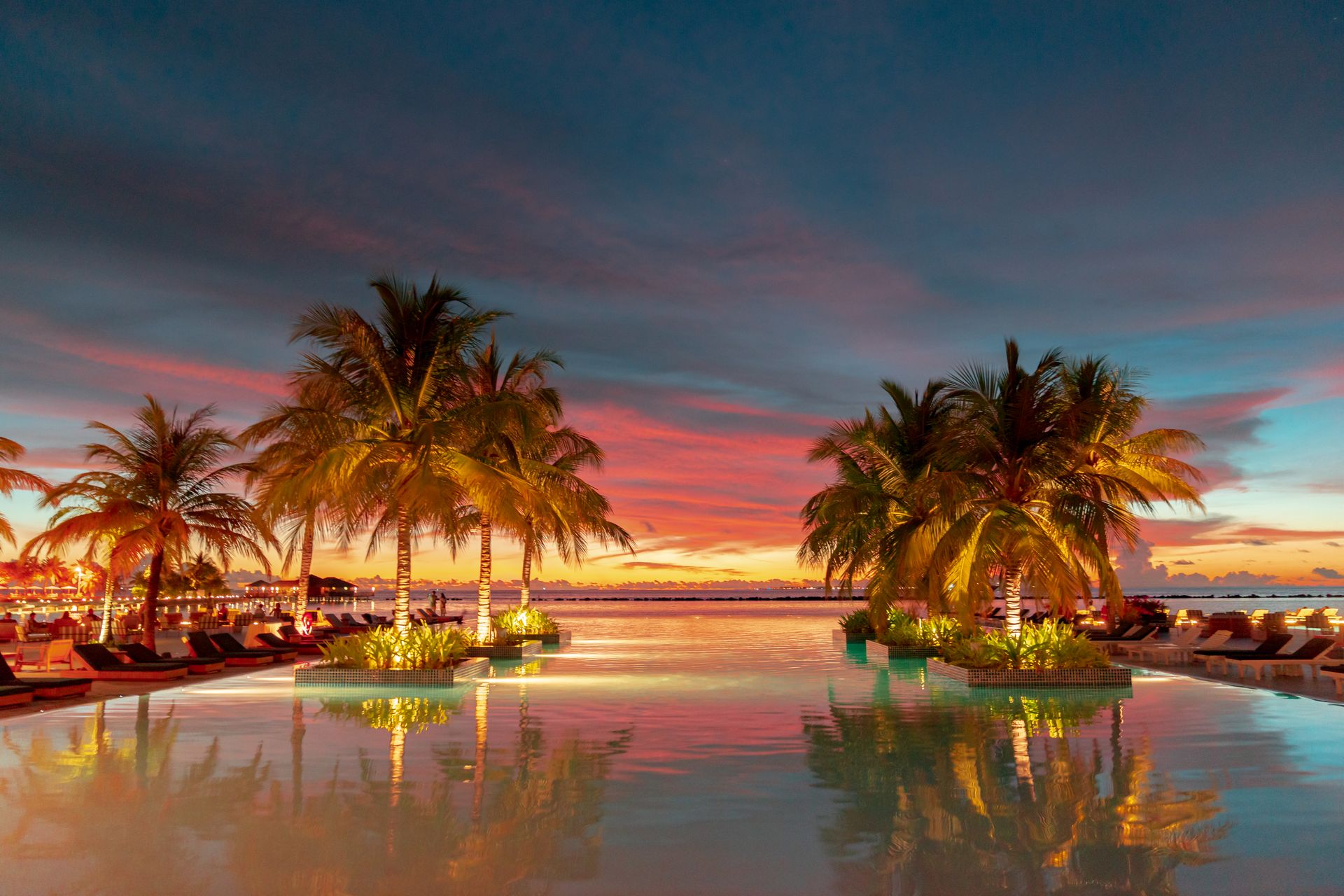 A beachfront resort at sunset